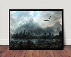 a painting on the wall of a room with a bird flying over water and mountains in the background