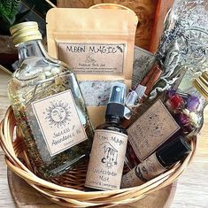 a wicker basket filled with bottles of liquor and other items sitting on top of a wooden table