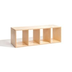 a wooden shelf sitting on top of a white floor