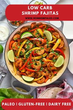 a skillet filled with shrimp, peppers and avocado on top of a table