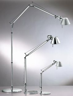 an image of three lamps on a table with one lamp turned on and the other turned off