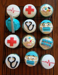 cupcakes with medical themed frosting are arranged on a cooling rack