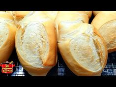 several loaves of bread sitting on top of a rack