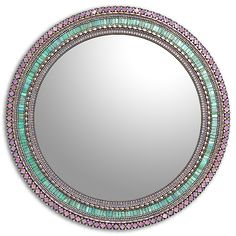 a round mirror with pink, green and blue accents