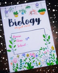 a sign that says biology with flowers and plants on the front, along with stars in the background