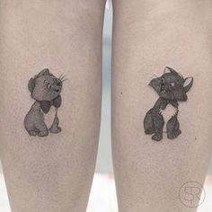 two tattoos on the legs of people with cat and mouse tattoo designs on their thighs