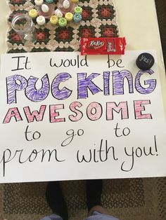 a sign that says it would be rockin'awesome to go prom with you