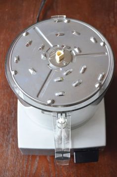 a food processor sitting on top of a wooden table