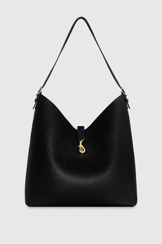 The Megan Hobo is the ideal go-to bag for those seeking effortless style and functionality. Crafted from genuine leather, this spacious hobo is designed to fit all your essentials while maintaining a sleek and modern silhouette. Its magnetic snap closure and antique brass hardware add a touch of sophistication, making it a perfect choice for everyday wear. Style # HH24TMGHOB-BLACK Genuine Leather Antique Brass Hardware 13" W X 14. 5" H X 6. 25" D 23" Strap Drop Magnetic Snap Closure 1 Back Zip P Leather Outerwear, Female Founders, Antique Brass Hardware, Leather Dresses, Hobo Handbags, Brass Hardware, Hobo Bag, Handbag Accessories, Rebecca Minkoff