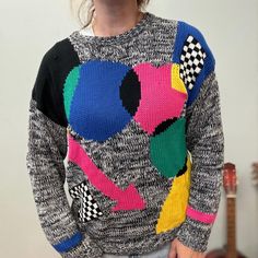 Jamie Scott Brand Tag Fits like a LARGE USA WOMENS 100% acrylic made in korea measurements lying flat: shoulders: 22" Bust: 22" waist: 20" length: 23" sleeve opening: 8.5" shoulder to cuff 21" Playful Multicolor Winter Sweater, Oversized Multicolor Retro Sweater, Playful Multicolor Long Sleeve Sweater, Vintage Multicolor Sweater With Graphic Print, Circle Arrow, 80s Print Sweater, Geometric Circle, Brand Tags, Colorful Sweaters