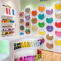 a room filled with lots of different types of beads and sprinkles on the wall