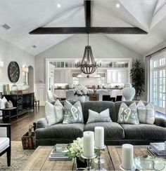 a living room filled with furniture and lots of windows