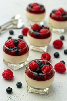 small desserts with berries and blueberries in them