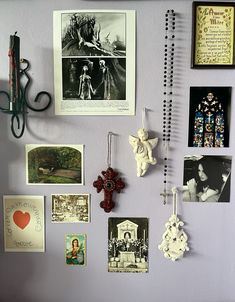 there are many pictures on the wall with scissors and other things hanging from it's hooks