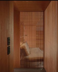 a wooden room with a screen on the wall