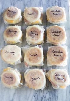 twelve small sandwiches with different labels on them