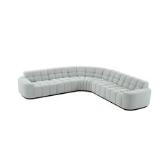 a large white couch sitting on top of a white floor