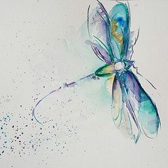 a watercolor painting of a blue dragonfly on a white paper with sprinkles