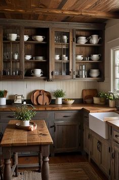 a kitchen filled with lots of wooden cabinets and counter top space next to a sink