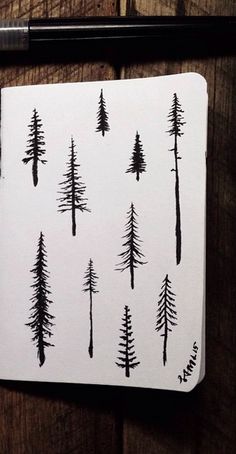 a piece of paper with trees drawn on it