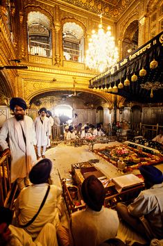 several men are standing in an ornate room