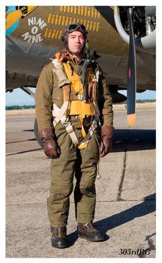 a man standing in front of an airplane