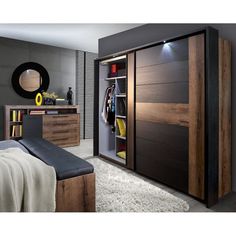 a bedroom with a bed, dresser and closet