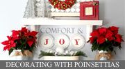 a christmas mantle with poinsettias and decorations