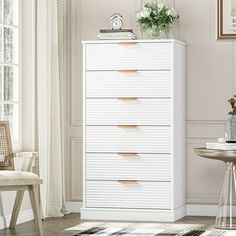 a white chest of drawers in a room