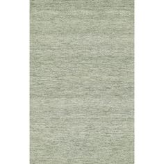 an area rug with light green tones