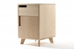 a small wooden cabinet with two drawers on one side and an open drawer on the other