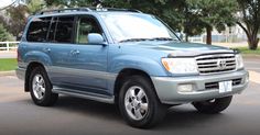 a blue toyota suv parked in a parking lot