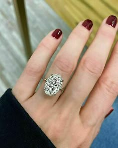 a woman's hand with a ring on it