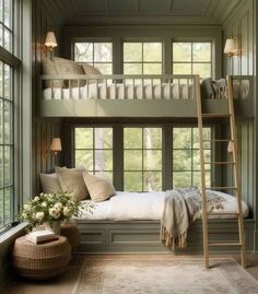 a bedroom with bunk beds and windows in it