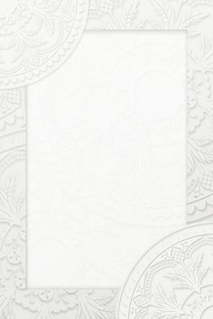 a white paper with intricate designs on the edges and an ornate design in the middle