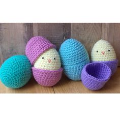 three crocheted easter eggs in different colors and sizes, one with an egg inside