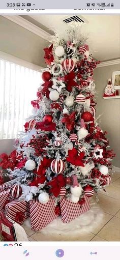 a christmas tree decorated with red and white ornaments