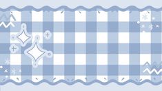 a blue and white checkered table cloth with stars, snowflakes, and hearts