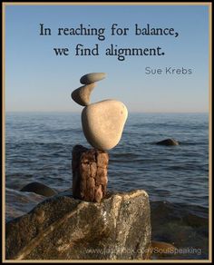 some rocks stacked on top of each other with a quote above them that says, in reaching for balance, we find alignment