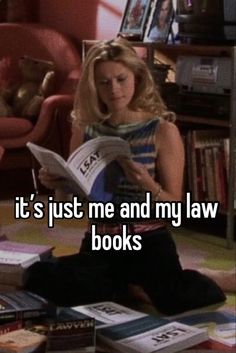 a woman sitting on the floor reading a book and looking at it's just me and my law books