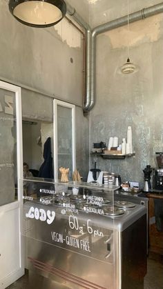 the inside of a restaurant with stainless steel counter tops