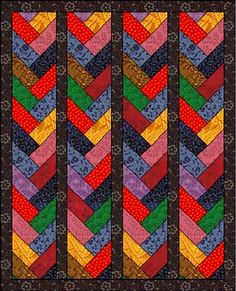 a quilted wall hanging with multicolored chevrons on it's black background