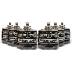 four bottles of black canisters sitting next to each other