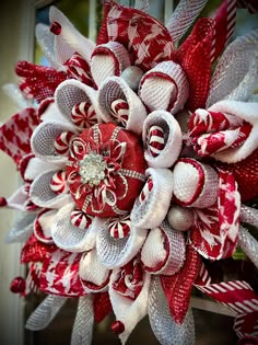 a red and white christmas wreath with candy canes