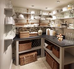 an organized pantry with baskets and other items