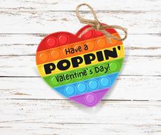 a heart shaped ornament that says have a poppin'valentine's day