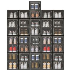 an organized plastic storage container filled with different types of bottles and sauces on top of each other