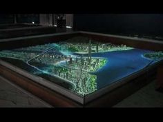 a model of a city is shown in the dark