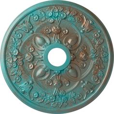 a decorative ceiling medallion with flowers and leaves on the center, painted in aqua blue