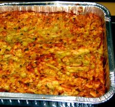 a casserole dish with cheese and broccoli in it